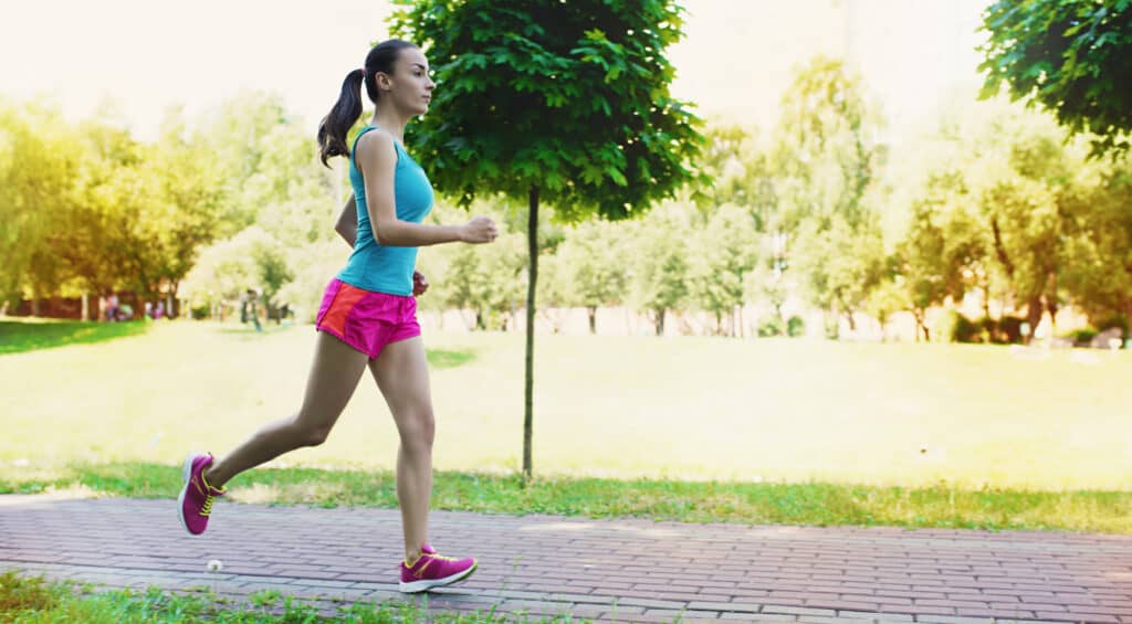 woman jogging after being helped with her ongoing pain