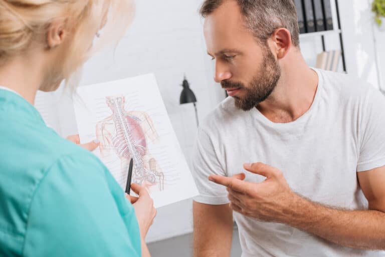physical therapist helping with chronic myofascial pain syndrome