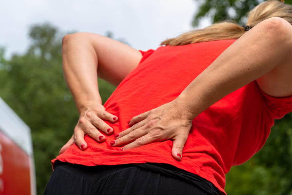 general aches and pains in woman's back