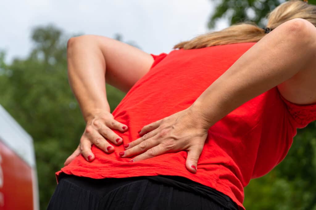 general aches and pains in woman's back general aches and pains in woman's back