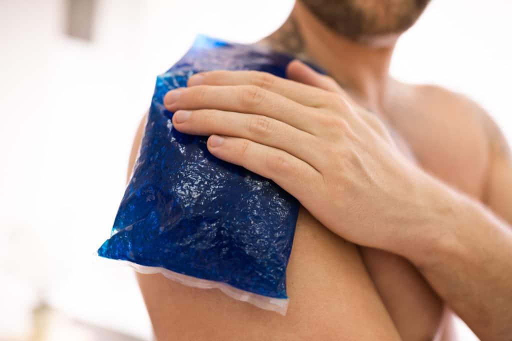 Man Applying Ice Bag On His Shoulder