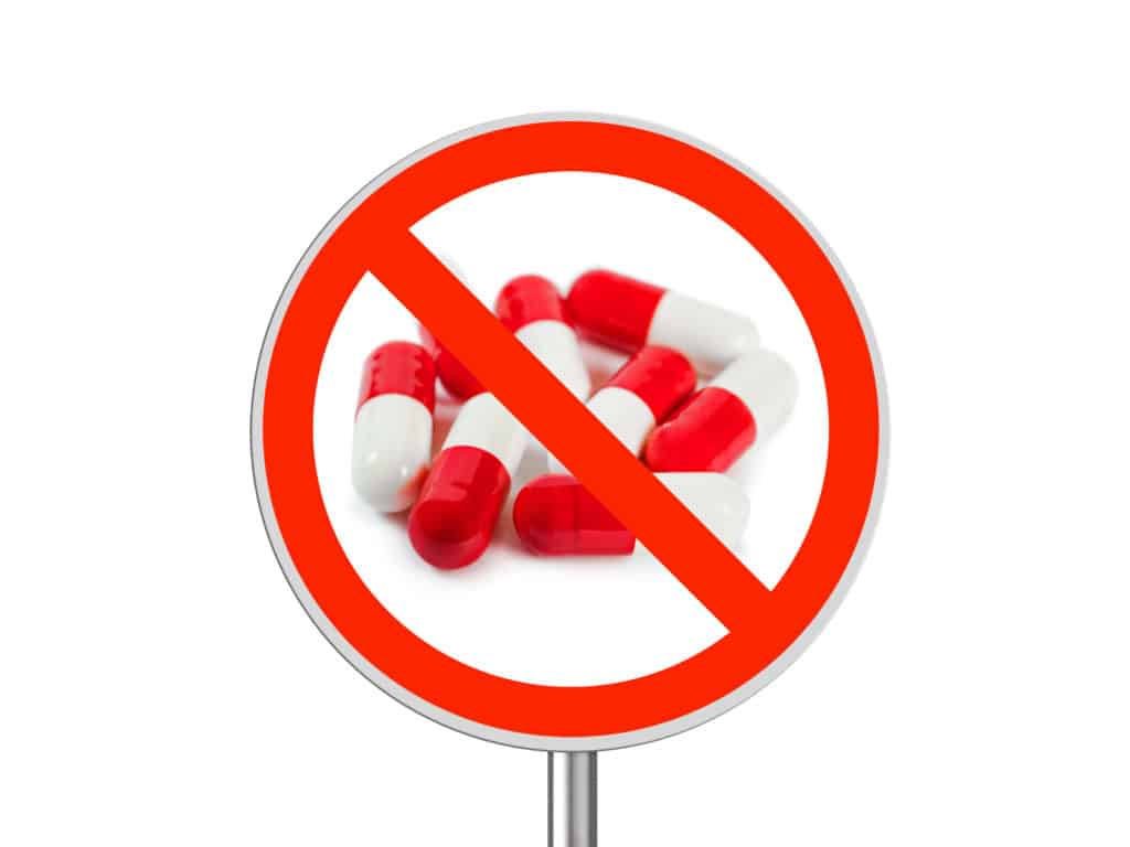 Sign with pills crossed out