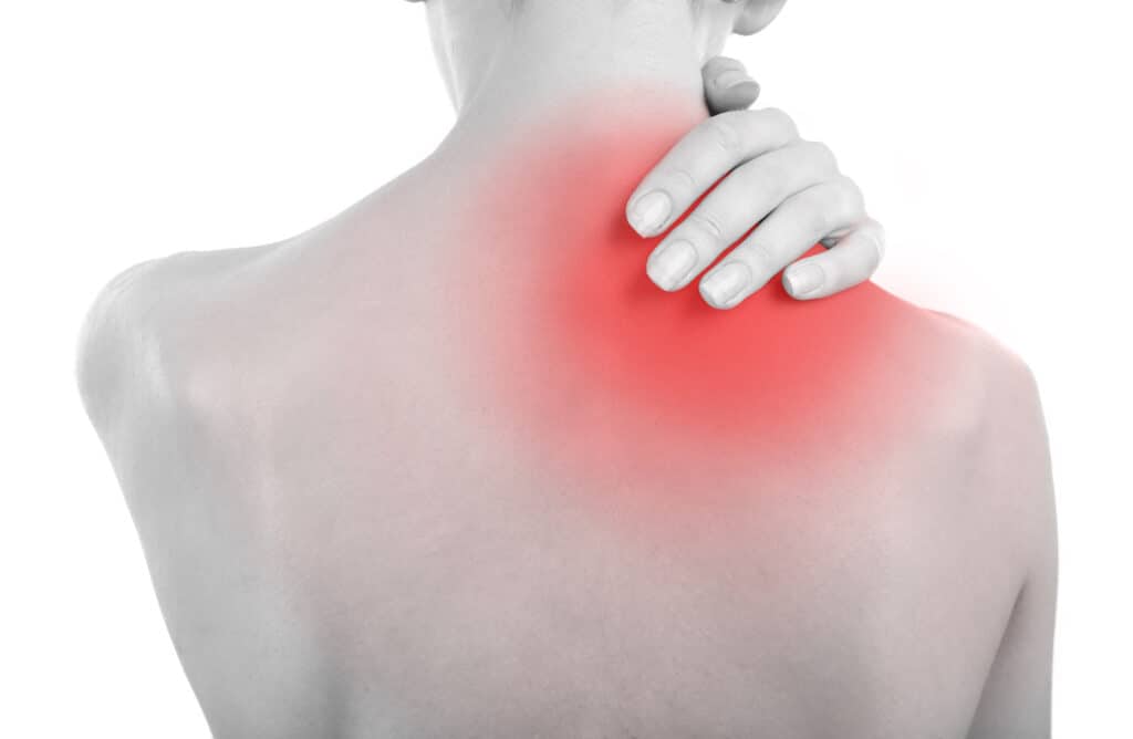 Young girl with back pain close up Young girl with back pain close up