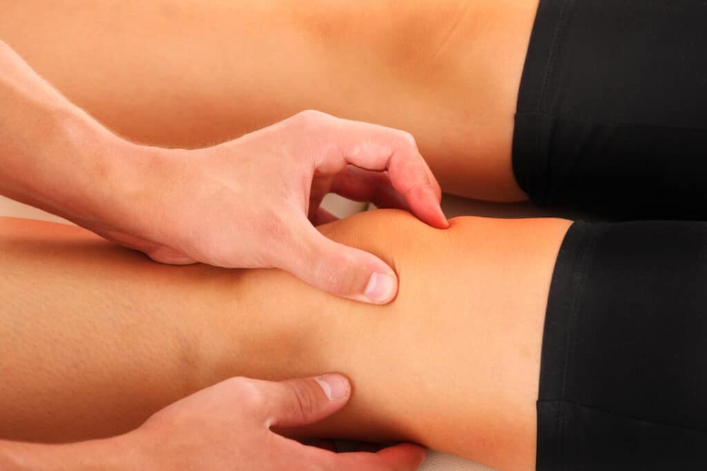 A picture of a physio therapist giving a knee massage